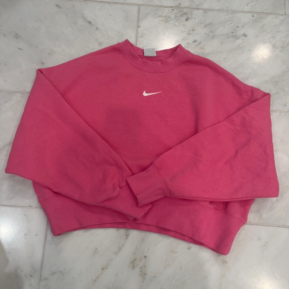 Pink woman’s Nike sweatshirt